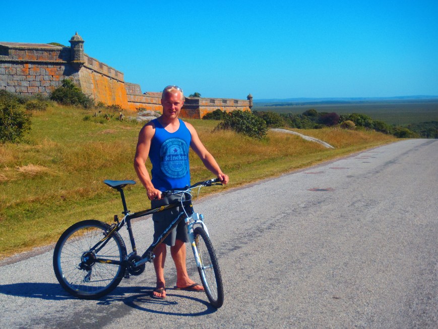 Joel & his hog, with the fort we explored behind